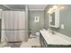 Clean and well-maintained bathroom with a shower, vanity and neutral decor at 44392 Dennis Rd, Albemarle, NC 28001