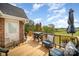 This deck offers a grilling area and comfortable seating with open views of the backyard at 44392 Dennis Rd, Albemarle, NC 28001