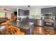 Contemporary kitchen featuring stainless steel appliances, granite countertops, and hardwood floors at 44392 Dennis Rd, Albemarle, NC 28001