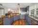 Well-equipped kitchen with granite countertops, and modern appliances and hardwood flooring at 44392 Dennis Rd, Albemarle, NC 28001
