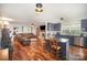 Open-concept living space with a kitchen island, hardwood floors and a cozy living area at 44392 Dennis Rd, Albemarle, NC 28001