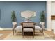 Charming dining room featuring a wooden table with six chairs, plants, and modern decor at 4551 Potters Wheel Dr, Fort Mill, SC 29715