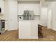 Bright kitchen featuring white cabinets, stainless steel appliances, and an island with bar seating at 4551 Potters Wheel Dr, Fort Mill, SC 29715