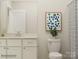 Clean bathroom with white cabinetry, modern fixtures, and stylish decor at 4563 Potters Wheel Dr, Fort Mill, SC 29715