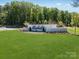 View of the Elizabeth neighborhood community entrance with lush green lawns and manicured landscaping at 4563 Potters Wheel Dr, Fort Mill, SC 29715