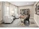 Comfortable home office setup with ample natural light, a work desk, and cozy seating for productivity at 517 Durango Way, Denver, NC 28037