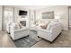 Inviting living room featuring a fireplace, plush seating, and a stylish area rug, perfect for relaxation at 517 Durango Way, Denver, NC 28037