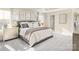 Serene main bedroom featuring plush bedding, elegant nightstands, and soft lighting for a relaxing retreat at 517 Durango Way, Denver, NC 28037