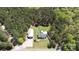 Aerial view of a residence with in-ground pool and a barn surrounded by trees at 5381 Mount Carmel Rd, Heath Springs, SC 29058