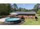 Above ground pool and wooden deck area offering outdoor relaxation and leisure at 5381 Mount Carmel Rd, Heath Springs, SC 29058