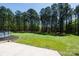 Spacious backyard surrounded by trees and featuring a well manicured lawn at 5381 Mount Carmel Rd, Heath Springs, SC 29058
