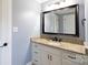Bathroom featuring vanity with granite counters, updated fixtures, and a modern mirror at 5381 Mount Carmel Rd, Heath Springs, SC 29058