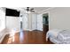 Bedroom featuring hardwood floors, a ceiling fan, and an attached bathroom at 5381 Mount Carmel Rd, Heath Springs, SC 29058