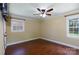 Bedroom with ceiling fan, wood floor, and large windows at 5381 Mount Carmel Rd, Heath Springs, SC 29058