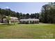 Charming brick ranch home featuring a large front yard and mature trees in a serene setting at 5381 Mount Carmel Rd, Heath Springs, SC 29058