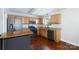 Well-equipped kitchen features stainless steel appliances, granite countertops, and custom cabinetry at 5381 Mount Carmel Rd, Heath Springs, SC 29058