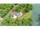 An impressive aerial view showcases the estate's landscaping and private lakeside setting at 542 Lochaven Rd, Waxhaw, NC 28173