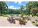 Serene outdoor setting with plush seating around a fire pit overlooking the lake at 542 Lochaven Rd, Waxhaw, NC 28173