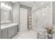 The primary bathroom features a walk-in shower, marble floors, a vanity, and a decorative towel ladder at 542 Lochaven Rd, Waxhaw, NC 28173