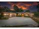 Stunning home exterior featuring a spacious driveway and a three-car garage at 542 Lochaven Rd, Waxhaw, NC 28173