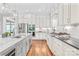 Modern kitchen featuring light cabinets, stainless steel appliances, and hardwood floors at 542 Lochaven Rd, Waxhaw, NC 28173