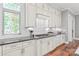 Close-up of a well-lit kitchen area with white cabinets and granite countertop at 542 Lochaven Rd, Waxhaw, NC 28173