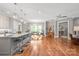 Open concept living area with island seating, dining space and a temperature-controlled wine rack at 542 Lochaven Rd, Waxhaw, NC 28173