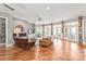 Spacious living room with a fireplace, tile surround, hardwood floors, and natural light at 542 Lochaven Rd, Waxhaw, NC 28173