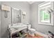 Chic powder room featuring a modern vanity, decorative lighting, and stylish accents at 542 Lochaven Rd, Waxhaw, NC 28173