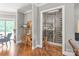 Hallway with a beautiful wine cellar featuring glass enclosure and wooden accents at 542 Lochaven Rd, Waxhaw, NC 28173