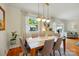 Bright dining room features a wooden table, pendant lighting, and stylish decor at 576 Scaleybark Rd, Charlotte, NC 28209