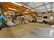 Spacious two-car garage with high ceilings, ample storage, and exposed wood beams at 576 Scaleybark Rd, Charlotte, NC 28209