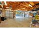 Spacious garage with two-car access, open door to a fenced back yard and organized storage solutions at 576 Scaleybark Rd, Charlotte, NC 28209