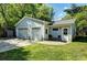 Detached garage with multiple bays, adjacent patio, and convenient yard access at 576 Scaleybark Rd, Charlotte, NC 28209