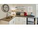 Kitchenette featuring granite countertops, stainless steel appliances and microwave at 576 Scaleybark Rd, Charlotte, NC 28209