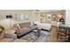 Modern living room featuring a comfortable couch, stylish coffee tables, and contemporary decor at 576 Scaleybark Rd, Charlotte, NC 28209