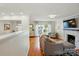 Bright living room with hardwood floors, a modern fireplace, and natural light at 576 Scaleybark Rd, Charlotte, NC 28209