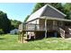 Spacious back yard featuring a covered back porch and lush green grass at 5769 Birch St, Conover, NC 28613