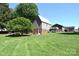 Expansive backyard with well-maintained lawn, mature trees, and exterior view of home at 5769 Birch St, Conover, NC 28613