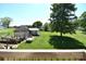Backyard view from deck showcasing storage buildings, a yard, and some equipment at 5769 Birch St, Conover, NC 28613