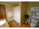 Cozy bathroom with white shower curtain, wood floors, and a shelf at 5769 Birch St, Conover, NC 28613