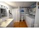 Functional bathroom with a vanity, shower, toilet, and washer/dryer for added convenience and efficiency at 5769 Birch St, Conover, NC 28613