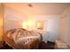 Cozy bedroom featuring a comfortable bed, dresser, and neutral decor at 5769 Birch St, Conover, NC 28613