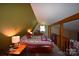Attic bedroom with a quilt, dresser, and natural light at 5769 Birch St, Conover, NC 28613
