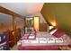 Cozy bedroom with quilt, wood furniture, and attached bath at 5769 Birch St, Conover, NC 28613