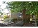 Charming home with mature landscaping, a brick chimney, and a cozy front porch at 5769 Birch St, Conover, NC 28613