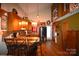 Open-concept kitchen featuring wood cabinets, bar seating, and seamless access to the living area at 5769 Birch St, Conover, NC 28613