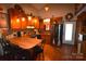 Charming kitchen with wooden cabinets, bar seating, and stainless steel appliances at 5769 Birch St, Conover, NC 28613