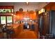 Charming kitchen featuring wood cabinets, stainless steel appliances, and a breakfast bar at 5769 Birch St, Conover, NC 28613