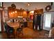 Cozy kitchen with wood cabinets, stainless steel refrigerator, and a breakfast bar at 5769 Birch St, Conover, NC 28613